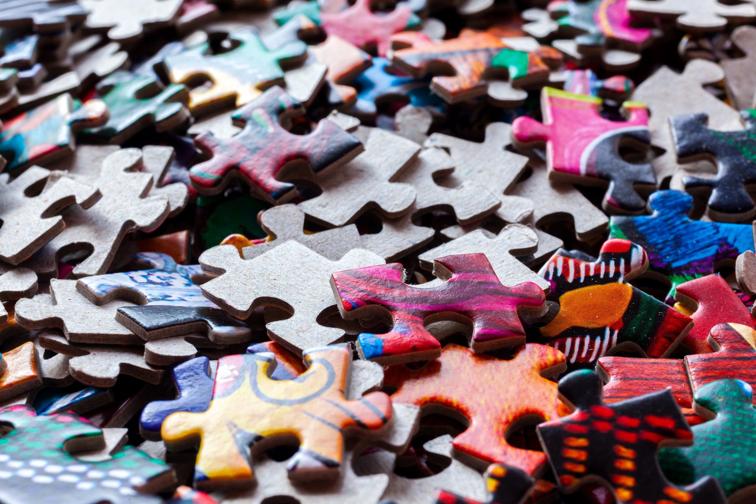 Close-up of colorful puzzle pieces showing unique shapes