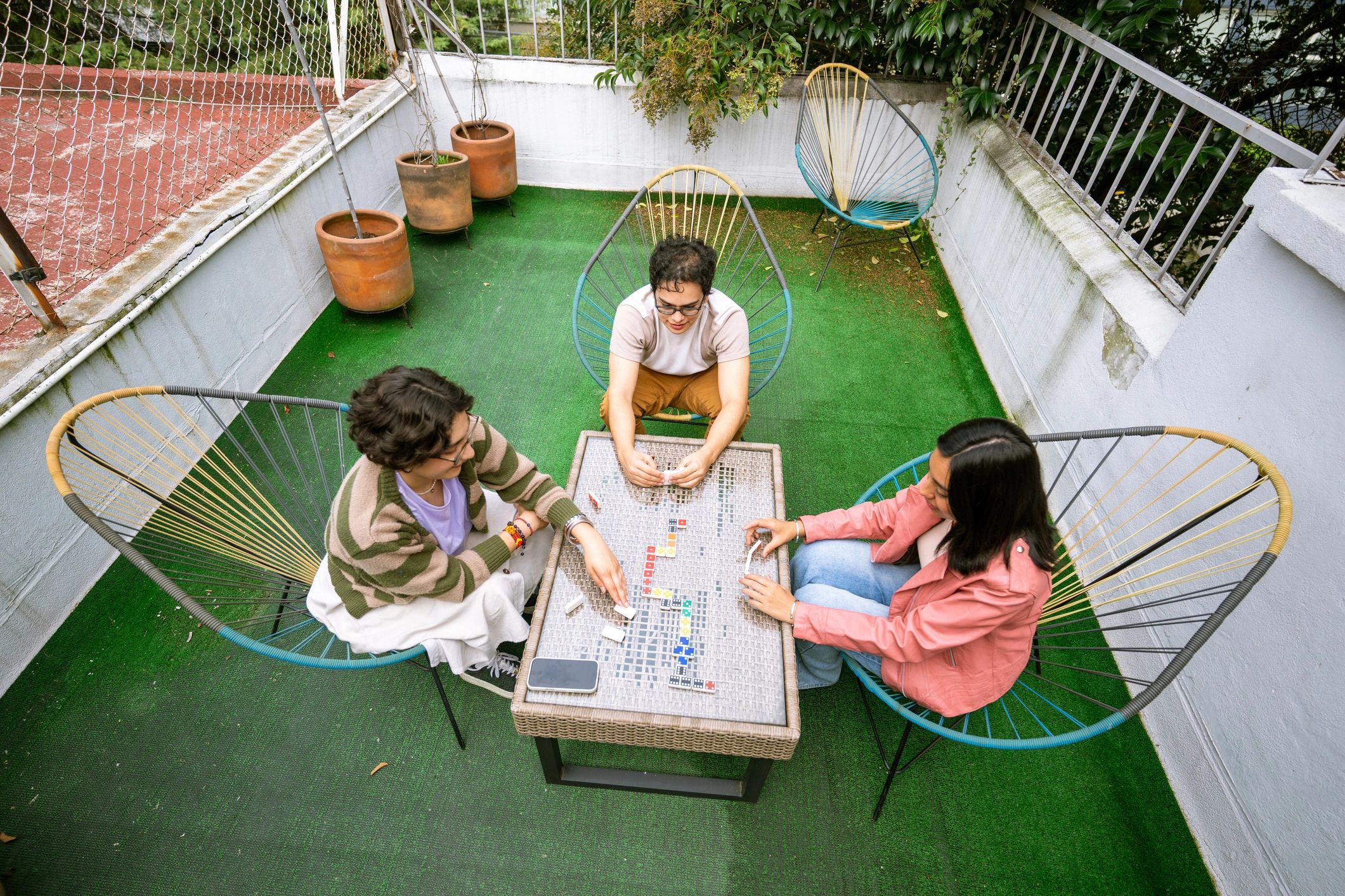 Smiling customer enjoying a tabletop game with friends
